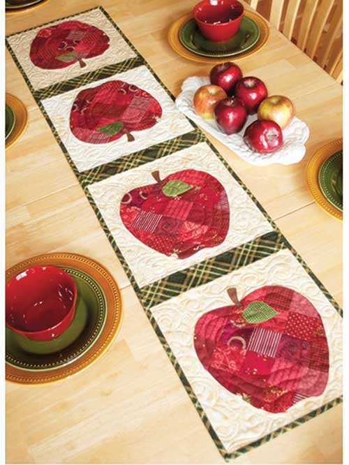 This cute patchwork table runner is perfect for your kitchen tabletop, or to give as a gift.